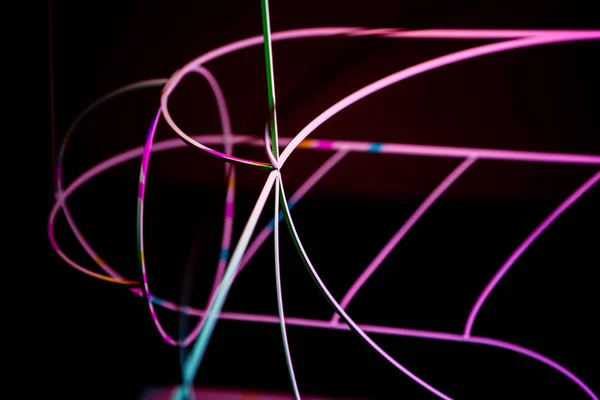 Neon green and red thin wire. Luminous wires, decoration and illumination of the surface. Electroluminescent wire, lighting objects and light base. — Stock Photo, Image