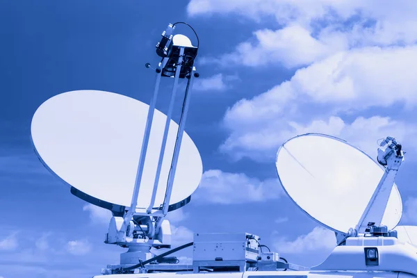 Satellite dish in blue color tone. — Stock Photo, Image