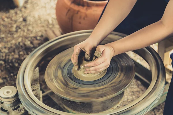 Hand making clay pot on roller. — Stock Photo, Image