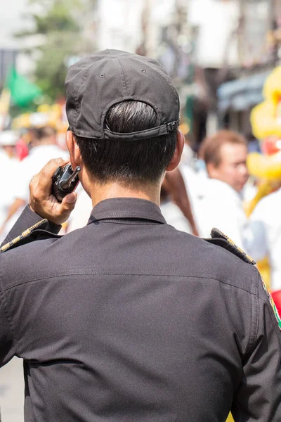 security agent officer working on radio communication.