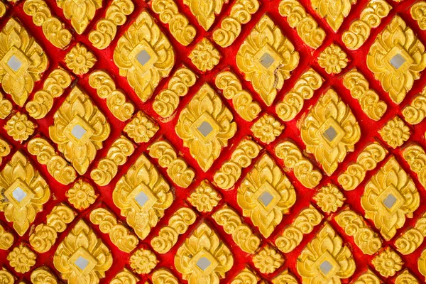 Thai culture golden flower pattern temple decoration.