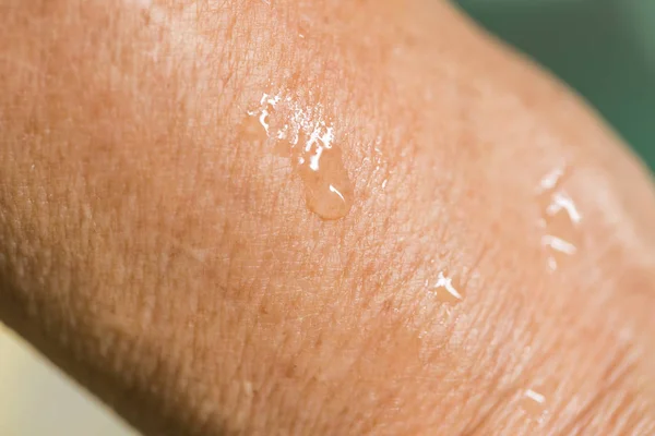 Elder skin wet, moisture sweat skin, arm with drop of water wet after sport. — Stock Photo, Image