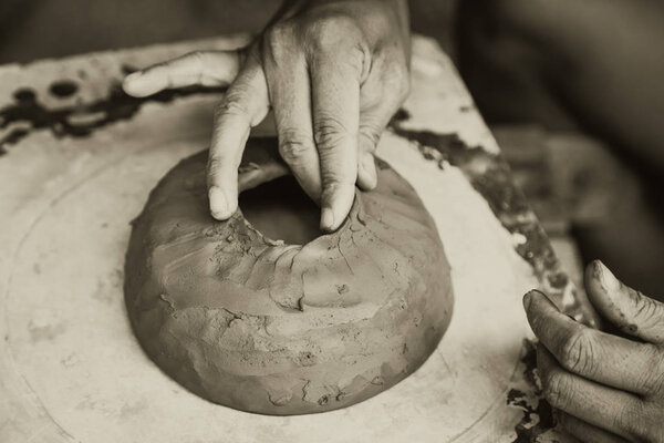 Asian Clay Sculpture Artist, heritage traditional art culture of antique earthware made by senior professional hand craft in Sukhothai Thailand