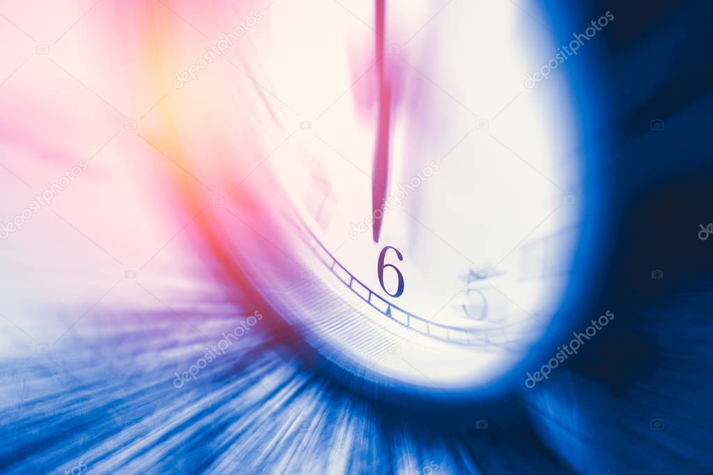 clock time with zoom motion blur focus at 6 o'clock