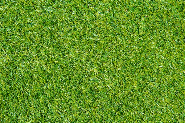 Zelená tráva nebo umělé trávě plastových travních pole vzorek textury — Stock fotografie