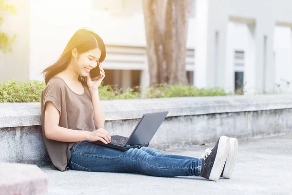 Asian Cute teen women in university using smartphone and laptop modern lifestyle. — Stock Photo, Image