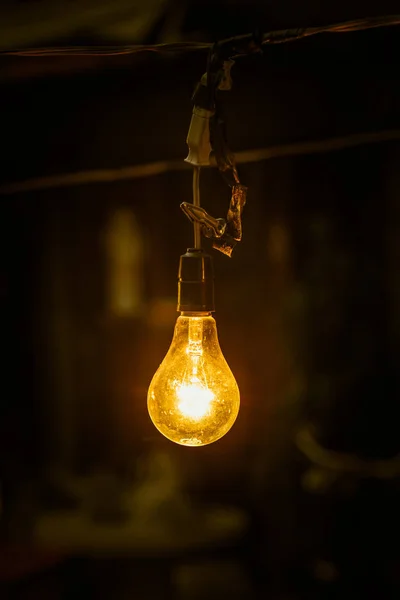 Lighting hang tungsten light bulb at night. — Stock Photo, Image