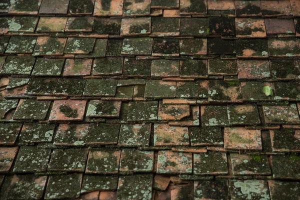 very old dirty roof tile of Thai Asian temple roof style architecture pattern background