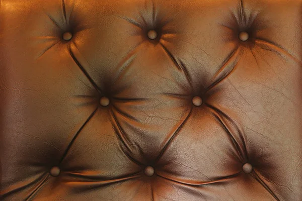 Gros plan de cuir marron fond ou texture canapé cuir — Photo