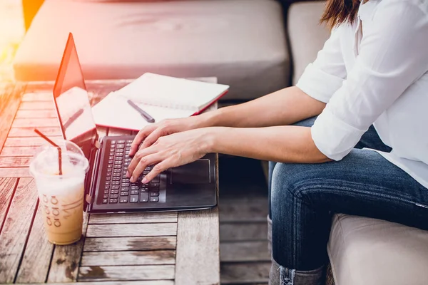 Asian Business woman work typing on laptop at coffee cafe workplace, Holiday working startup concept. — Stock Photo, Image