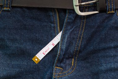 jeans open zip with measuring tape, penis size concept