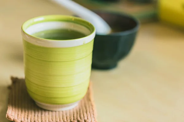 Matcha Japanese healthy drink. Hot Green tea drinking after food meal for good health. — Stock Photo, Image