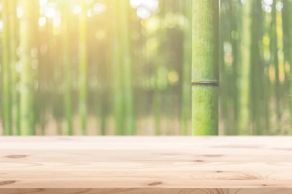Wood foreground with blur bamboo wood forest background design for display nature products — Stock Photo, Image