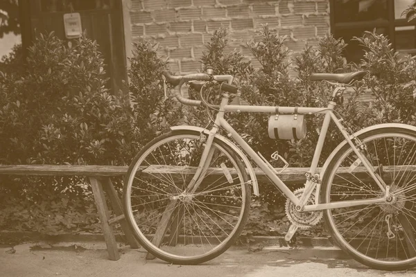 Vintage bike parking with old brown vintage color tone — Stock Photo, Image