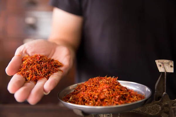 Safflower for diet tea and healthy low fat cooking oil herbal in herb store — Stock Photo, Image