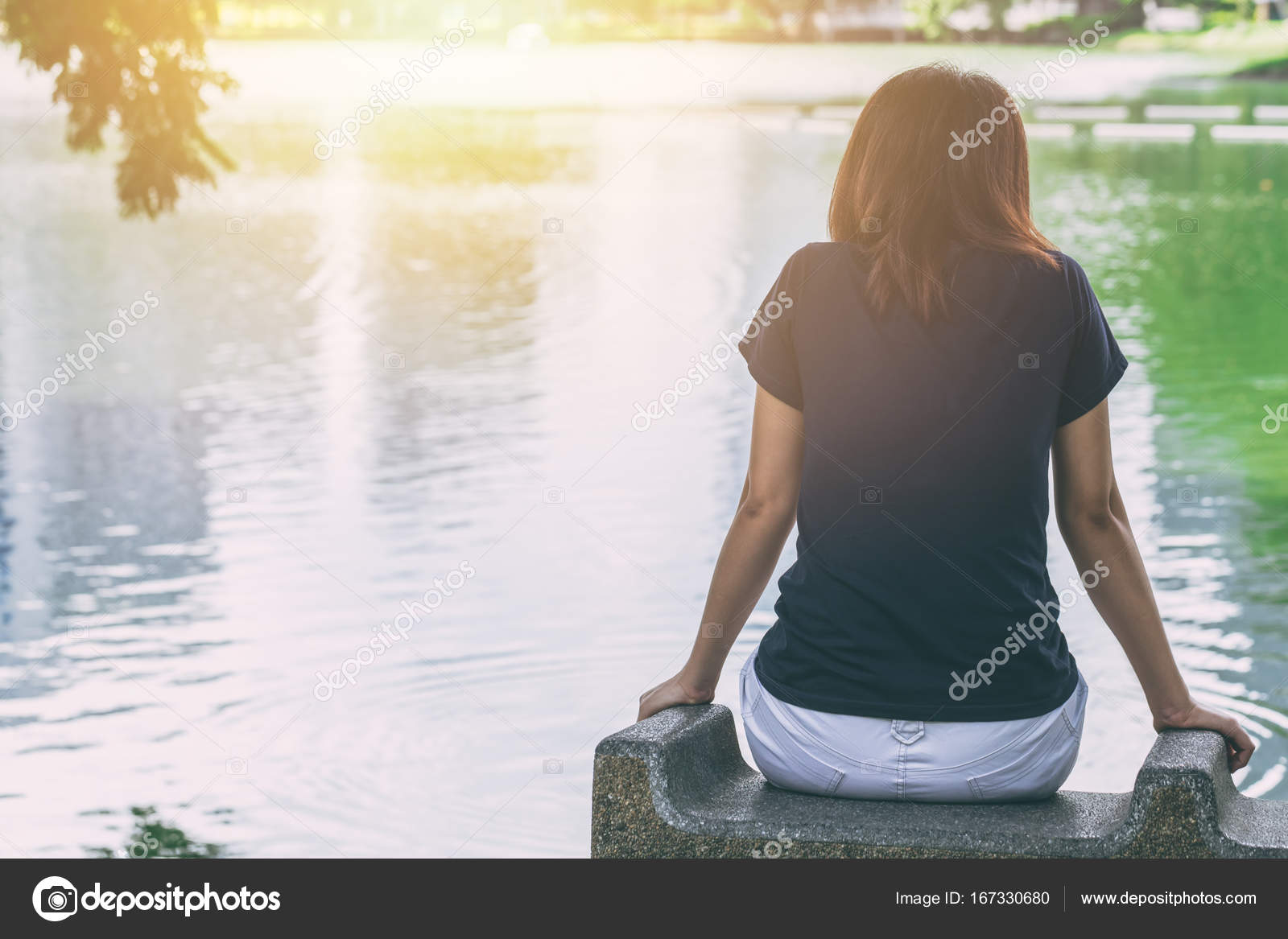 Teen sitting alone feeling lonely and thinking missing someone ...