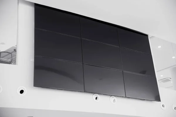 multiple screen LCD panel display in modern building office wall with clipping path at screen