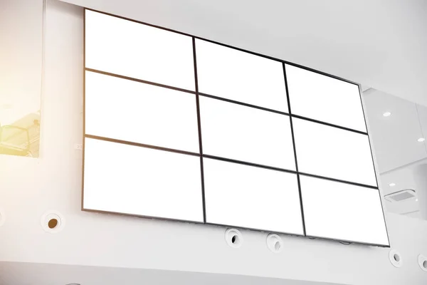 wall LCD display screen panel in modern office building with clipping path at blank screen
