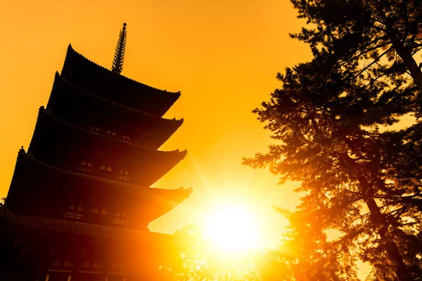 silhouette japanese shrine sunset sunny sky for travel poster in Kofukuji Temple Nara