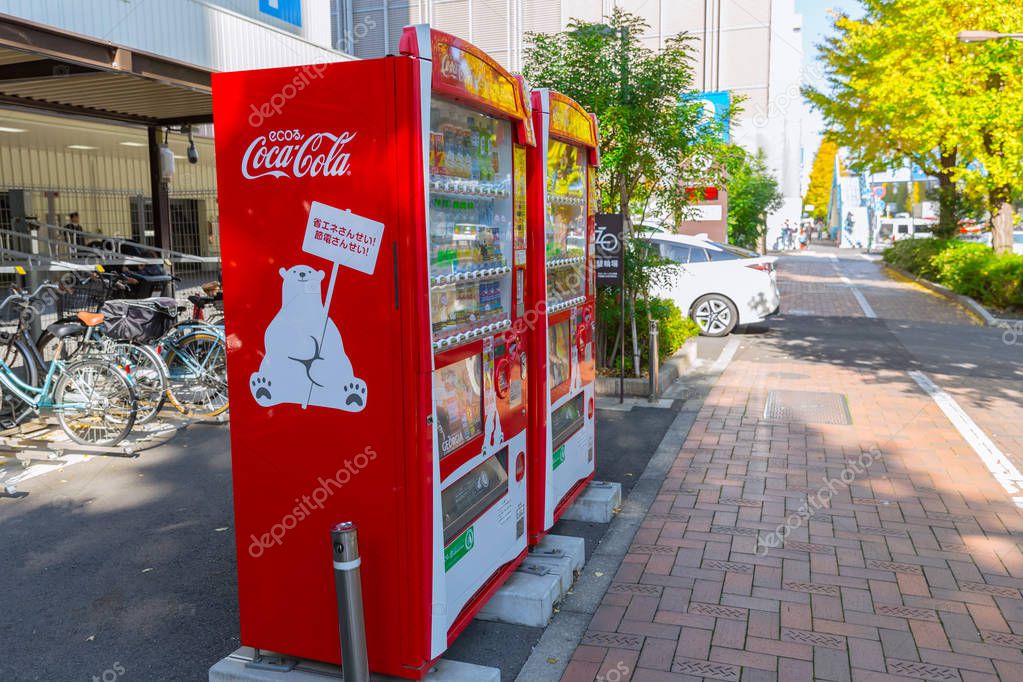 Eco Coca-Cola red vending machines sell beverage products with cute polar bear mascot found around Osaka Japan December 2017.