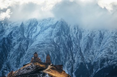 Caucasus mountains, Gergeti Trinity church, Georgia clipart