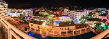 View from window of Santa Ponsa resort at night clipart