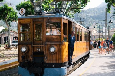 Travel attraction of Mallorca. A vintage tram runs from Palma to Soller clipart