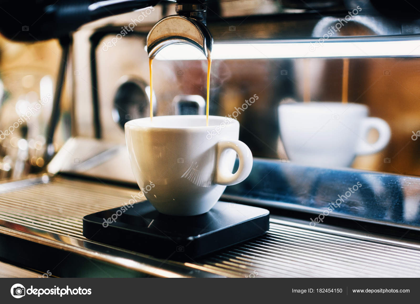 Espresso Machine Pouring Coffee Into White Cup Stock Photo Espresso Machine Pouring Coffee Into White Cup Stock Photo