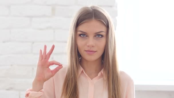 Young WomanGesturing Okay in Office — Stock Video