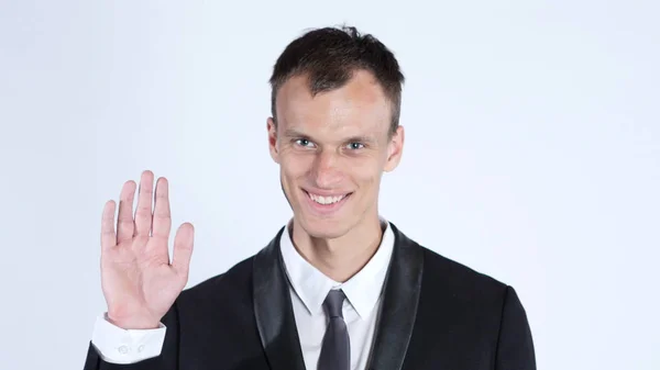Friendly Businessman waving and saying Hi, isolated on white — Stock Photo, Image