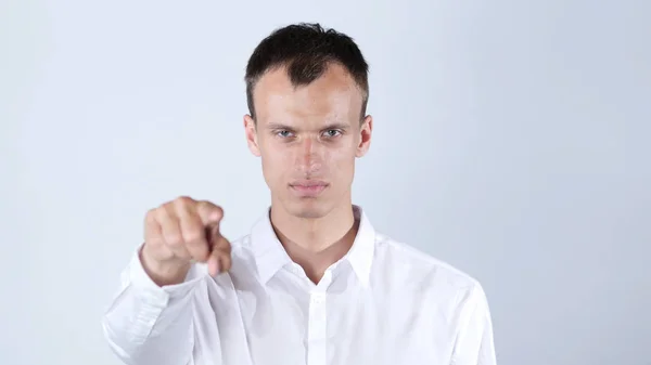 Man wearing white shirt   points at camera , white background — Stock Photo, Image