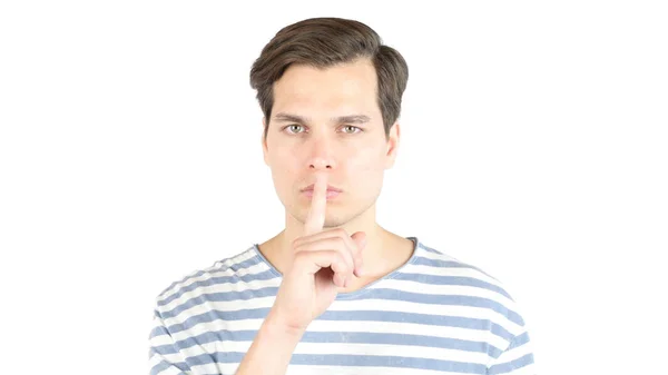 Knappe man een shushing gebaar verhogen van zijn vinger aan zijn lippen — Stockfoto