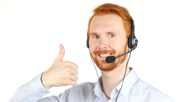Empresário sorridente com fone de ouvido polegar para cima, fundo branco — Fotografia de Stock