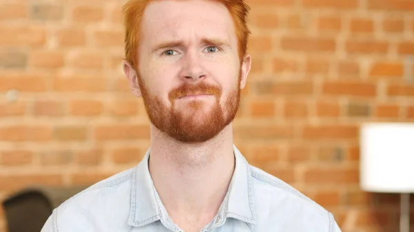 Portrait of sad Red Hair Young Man, Loft office, worried — Stok Foto