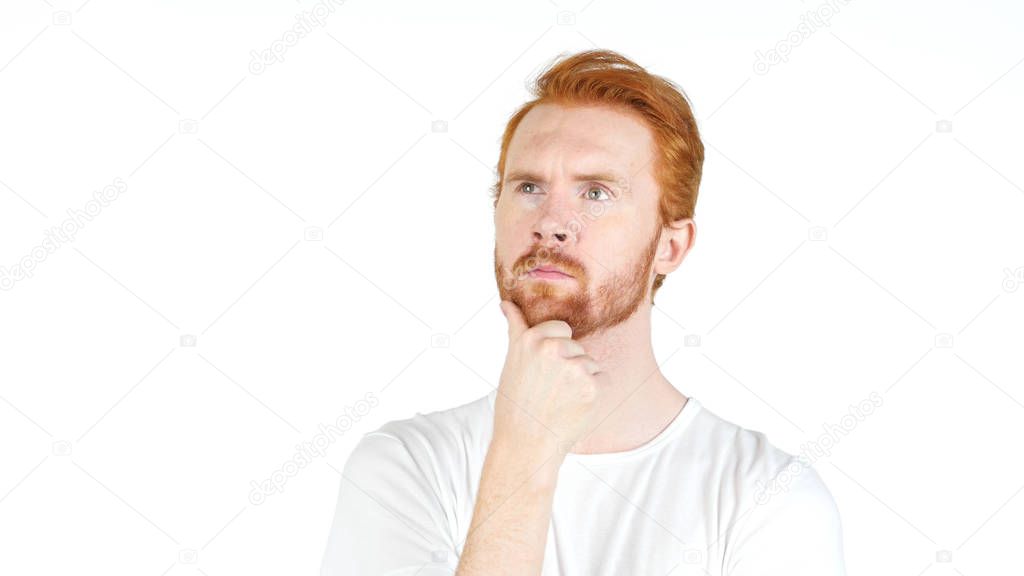 Thoughtful red hair casual young man, isolated over a white background
