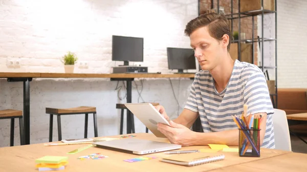 Man in office using Digital tablet PC, creative designer , agency