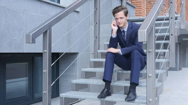 Young Businessman Phone Talk, Negotiation, Sitting on Stairs Outside Office