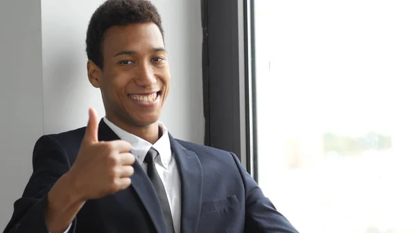 Thumbs Up by Afro-American  Man in Suit