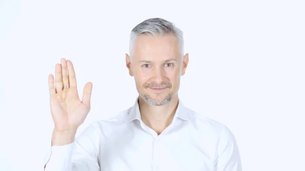 stock image Portrait Of Middle Aged Businessman Waving Hand , Saying Hello, White Background