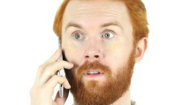 Yakın, Kızıl saçlı sakallı adam müzakere üstünde hareket eden telefon