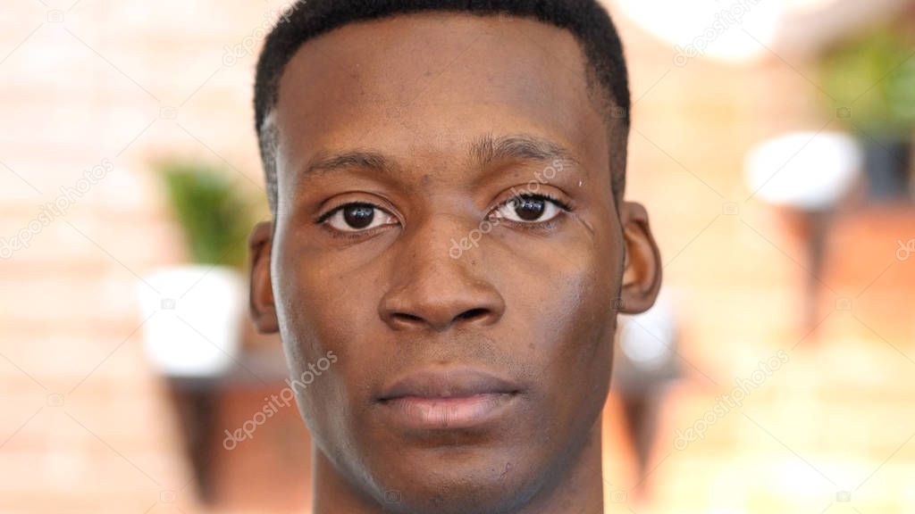 Close Up Of  Black Young Man Looking into Camera