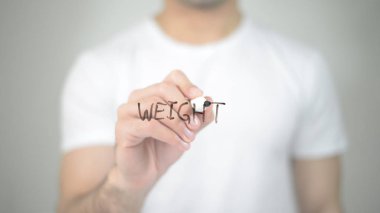 Ağırlık, şeffaf ekranda yazma adam