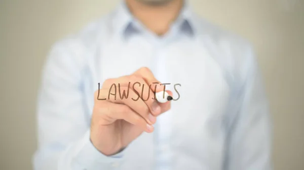 Law Suits, man writing on transparent screen — Stock Photo, Image