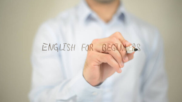 English For Beginners, man writing on transparent screen
