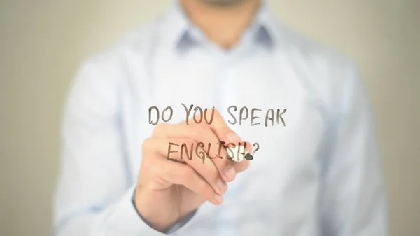 Sprichst du englisch?, schreibt ein Mann auf einem durchsichtigen Bildschirm — Stockfoto