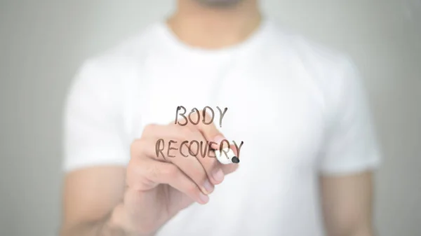 Body Recovery, man writing on transparent screen