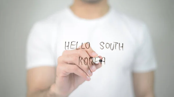 Hello South Korea, man writing on transparent screen