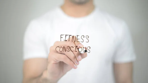 Fitness Consious, hombre escribiendo en pantalla transparente —  Fotos de Stock