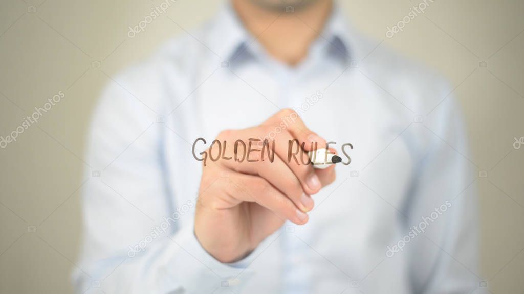 Golden Rules , man writing on transparent screen