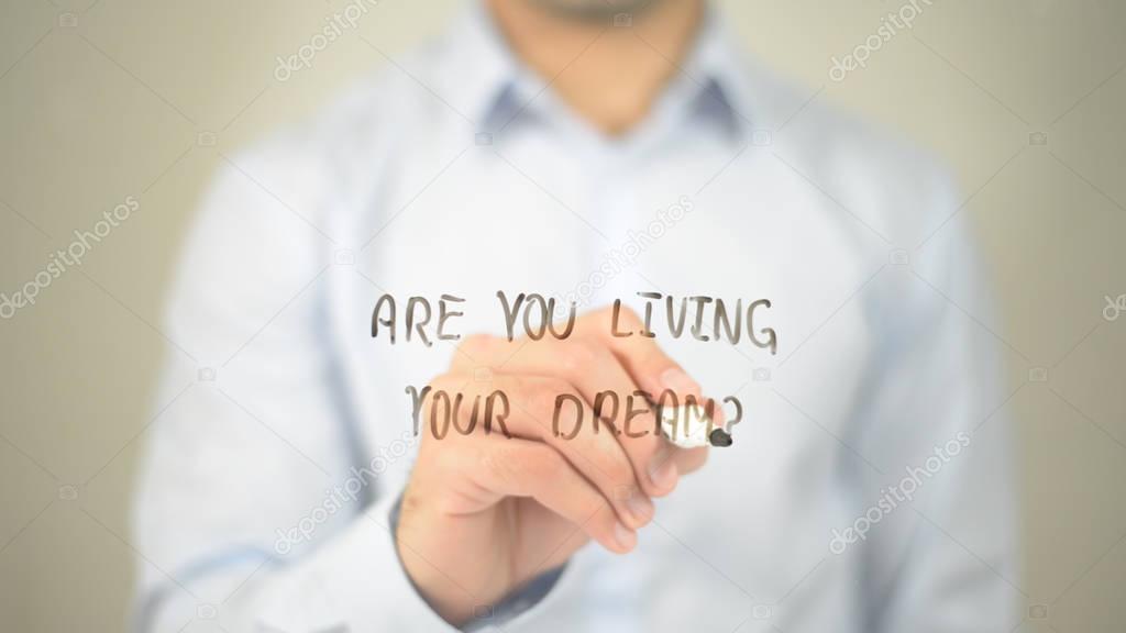 Are You Living Your Dream ? , man writing on transparent screen